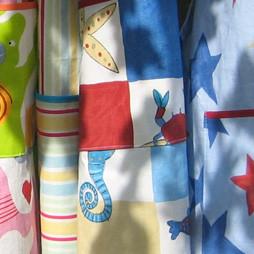 Handmade cotton aprons for both children and adults in a variety of styles, patterns and designs. Your can also choose whether to add personalisation or a monogram to your apron.&nbsp;